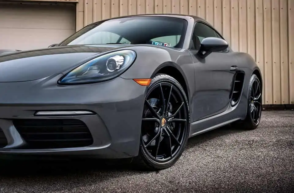 grey Porsche in a industrial zone